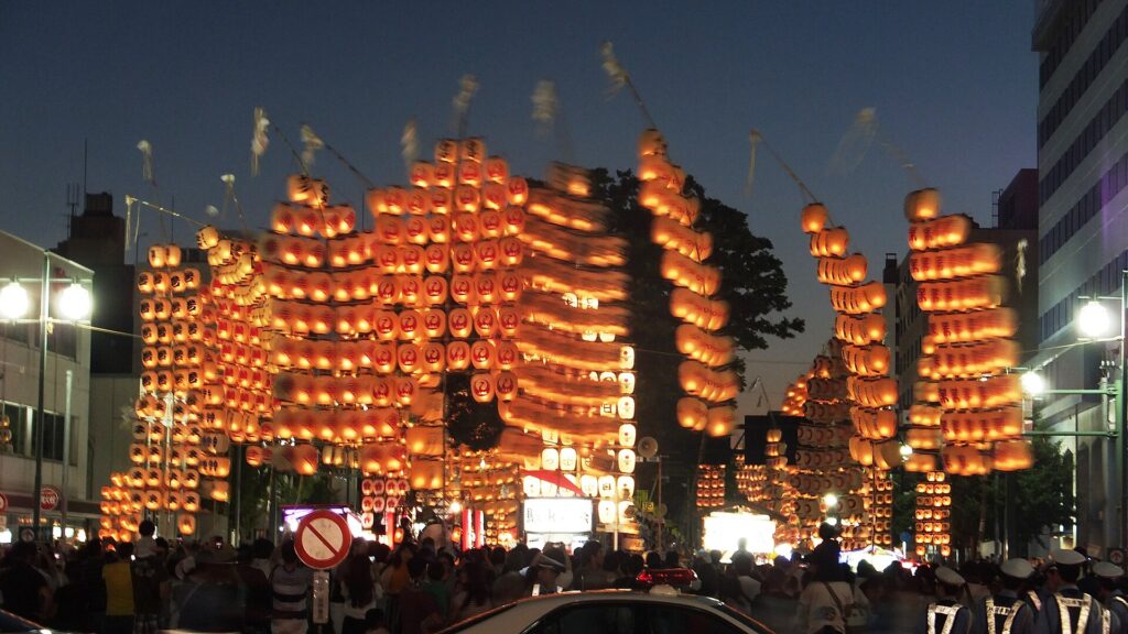 Performers balancing lantern poles at Akita Kanto Matsuri