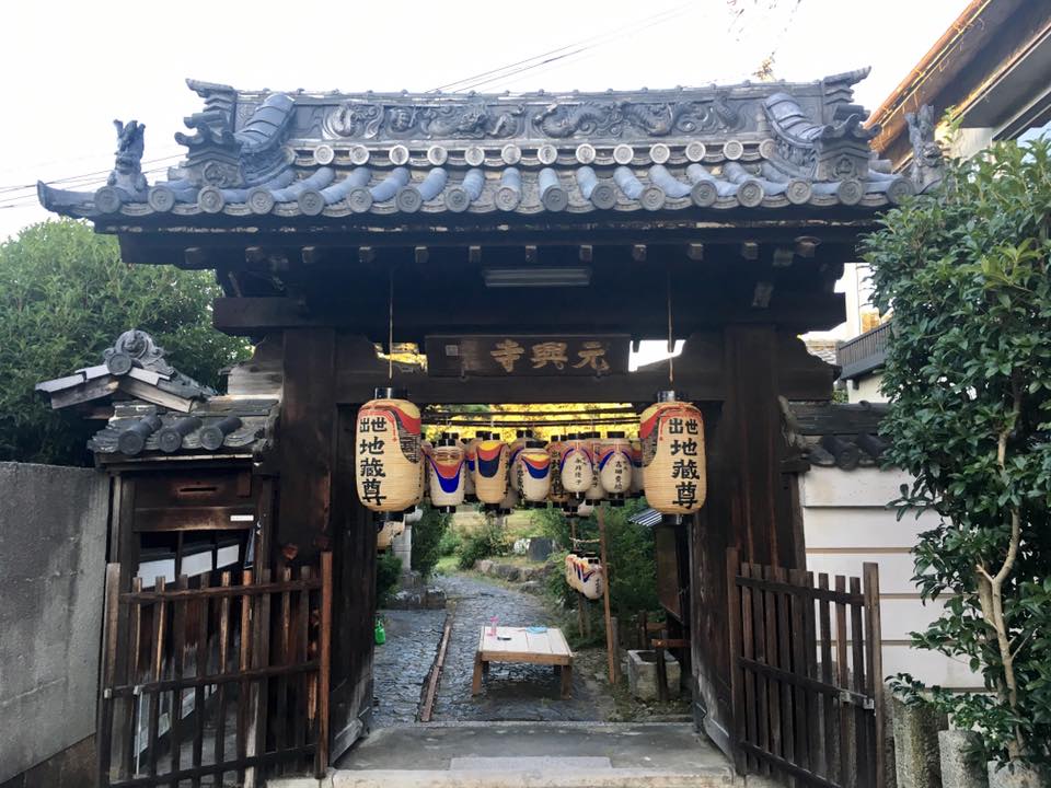 Oil lamps lit among stone pagodas at Gangoji temple, Nara, during Jizo-e Manto Kuyo