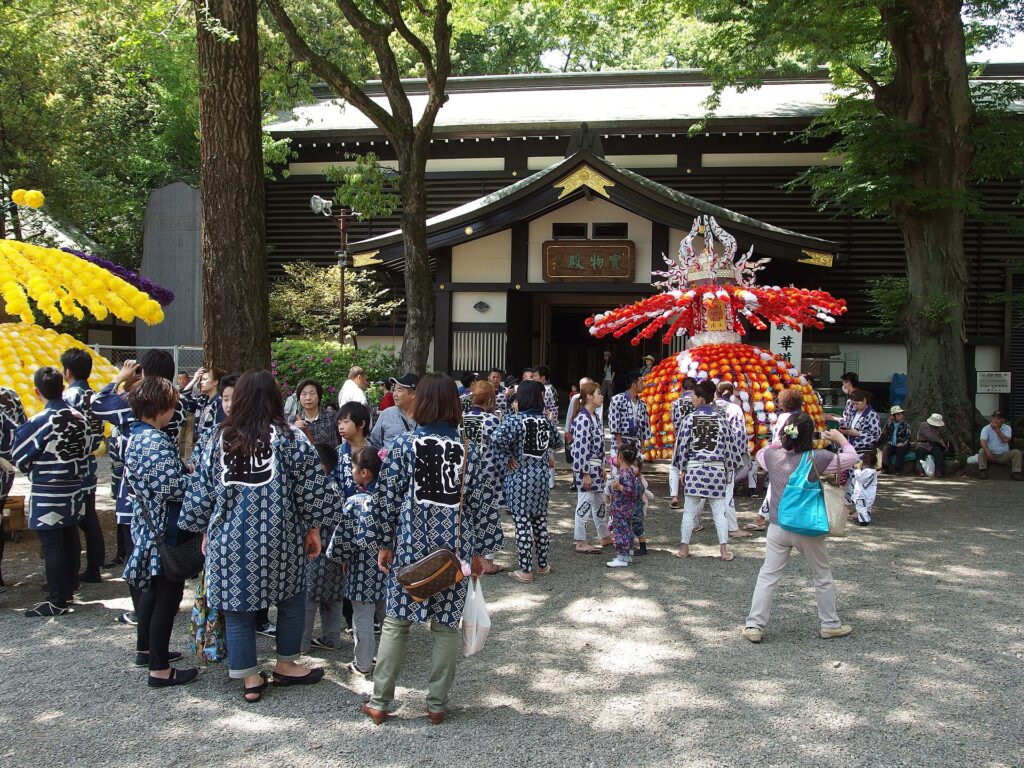 Portable shrine and crowds at Kurayami Matsuri in Fuchu