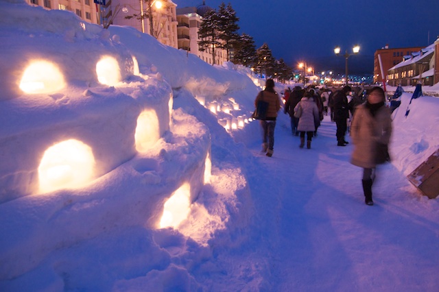 Snow candles glowing along the Otaru Canal during the Snow Light Path