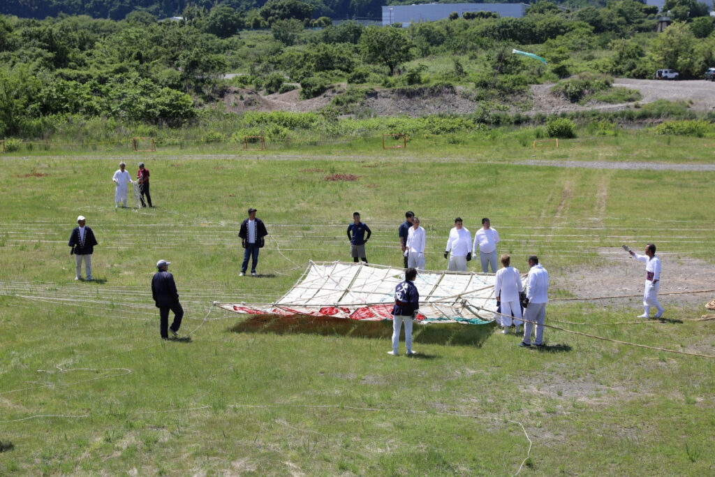 A large traditional Japanese kite being flown in the Sagami area