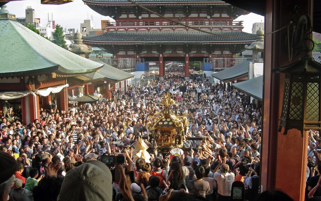 Mikoshi carried through crowds at Sanja Matsuri Asakusa