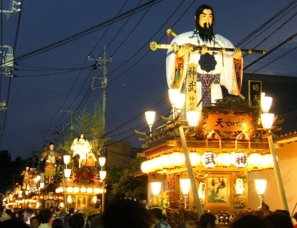 Tall wooden floats lined up during the Sawara Grand Festival