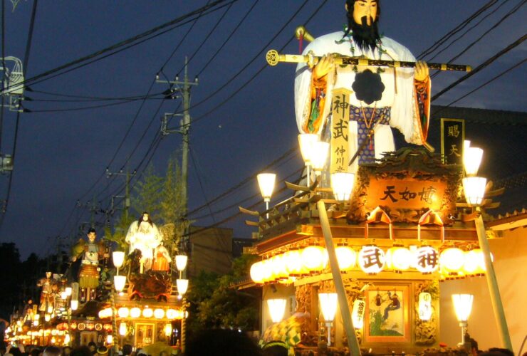 Tall wooden floats lined up during the Sawara Grand Festival