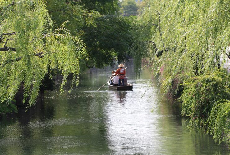 The canal and white-walled storehouses of the Kurashiki Bikan district