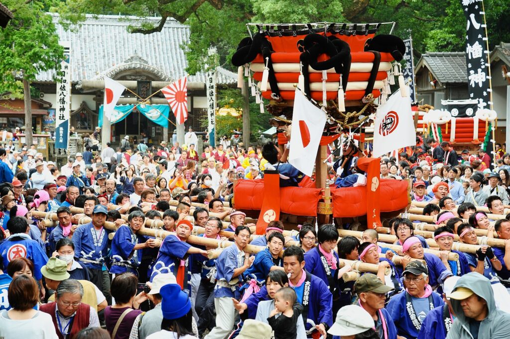 Chosa drum floats being carried at the Hiwasa Hachiman shrine autumn festival