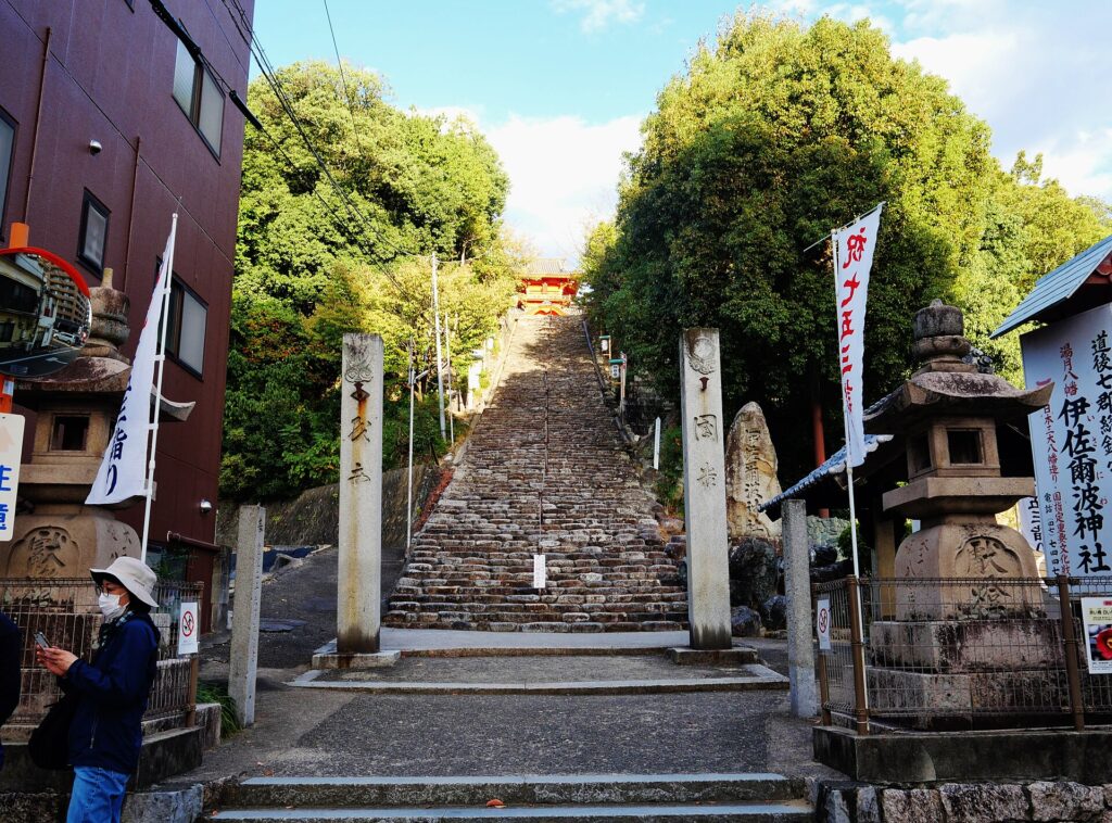 The steep stone stairway leading up to Isaniwa Shrine in Matsuyama